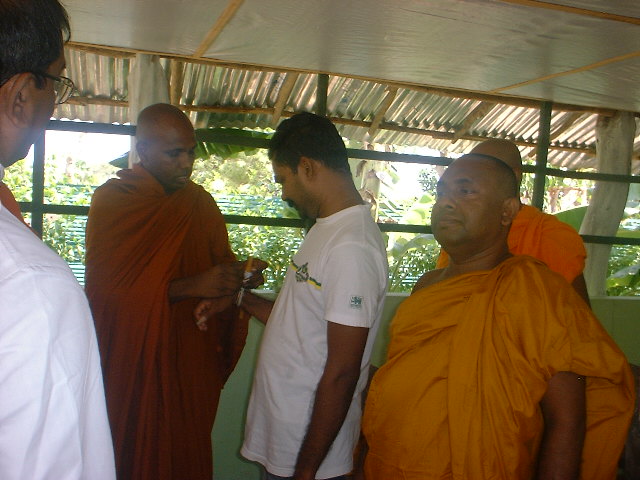 blessing to a sinhalese prisoner at kilinochchi prison-.JPG